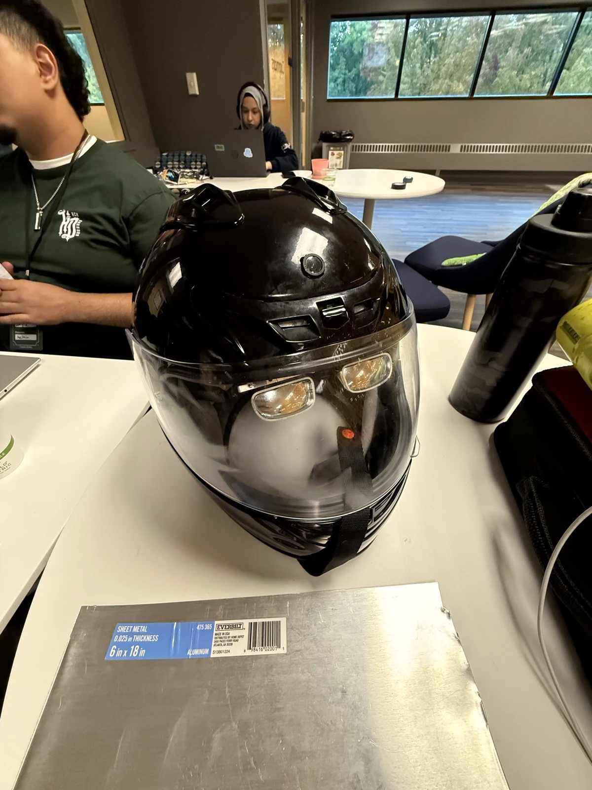 Front view of the helmet with the XREAL optics visible behind the visor